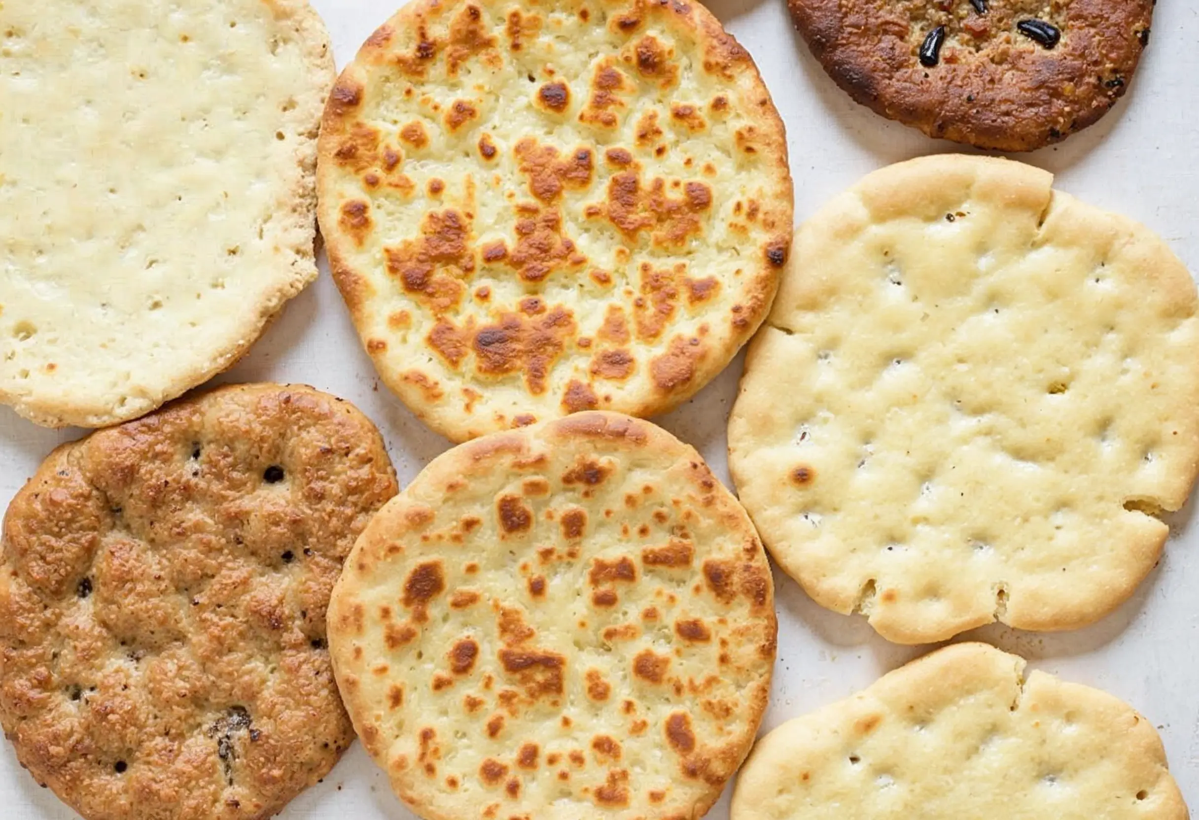 Variety of flatbreads including tortillas and chapati.